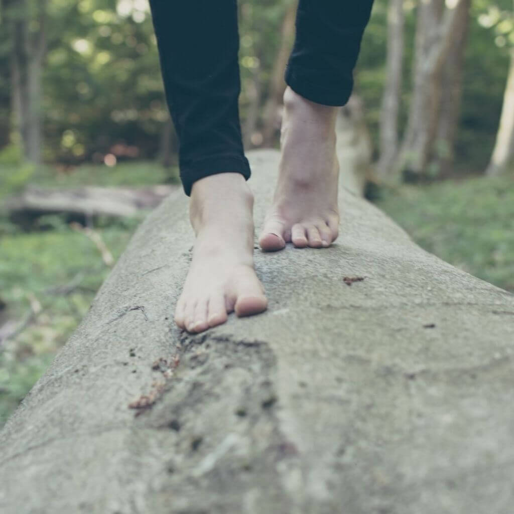 a person walking barefoot in nature